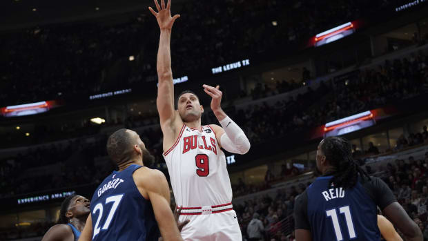 Chicago Bulls center Nikola Vucevic (9) shoots over Minnesota Timberwolves center Rudy Gobert (27) during the first quarter at United Center.